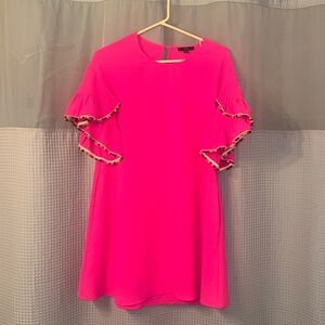 Pink pom-pom sleeve dress.